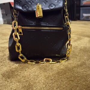 Louis Vuitton Black Backpack with Gold Chain